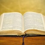 Old bible on golden background