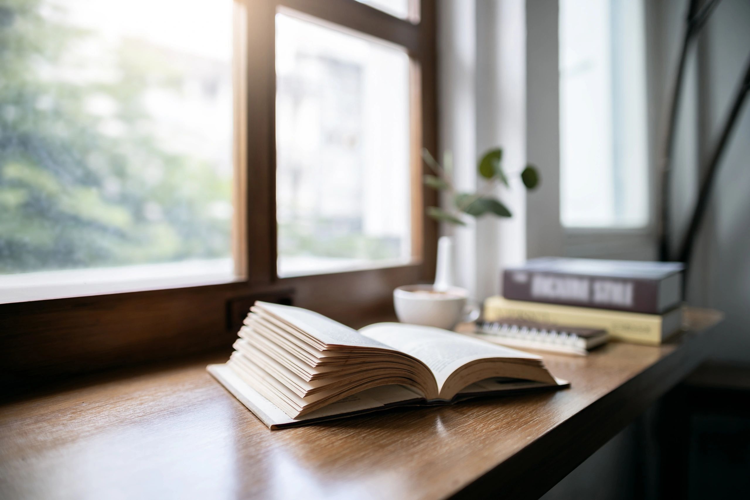 Open Bible on a table in warm light